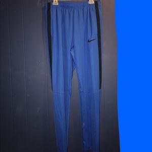 Blue Nike tapered athletic pants
